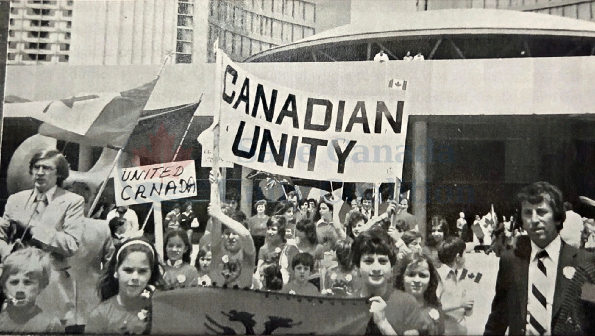 Children and adults with a Canadian Unity banner at Toronto City Hall at the 1980 rally.