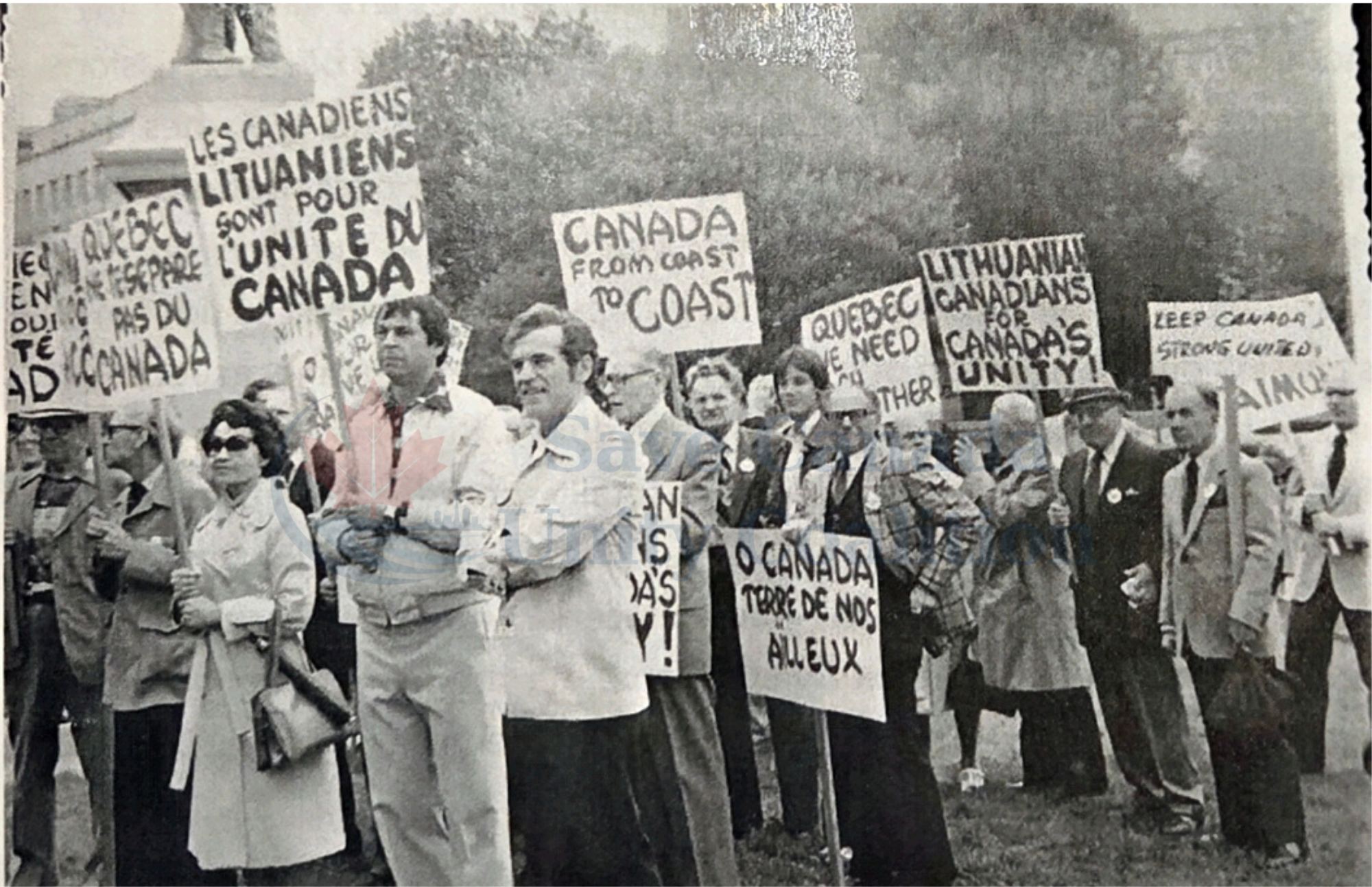 Crowd of marchers holding unity placards at the 1980 Canada Unity Rally in Toronto.